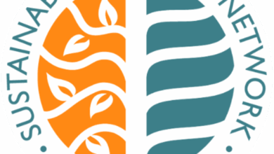 Circular logo with the text &ldquo;Sustainable Tourism Network Member 05-26&rdquo; surrounding a stylized tree, half orange with leaves and half teal with curved lines.